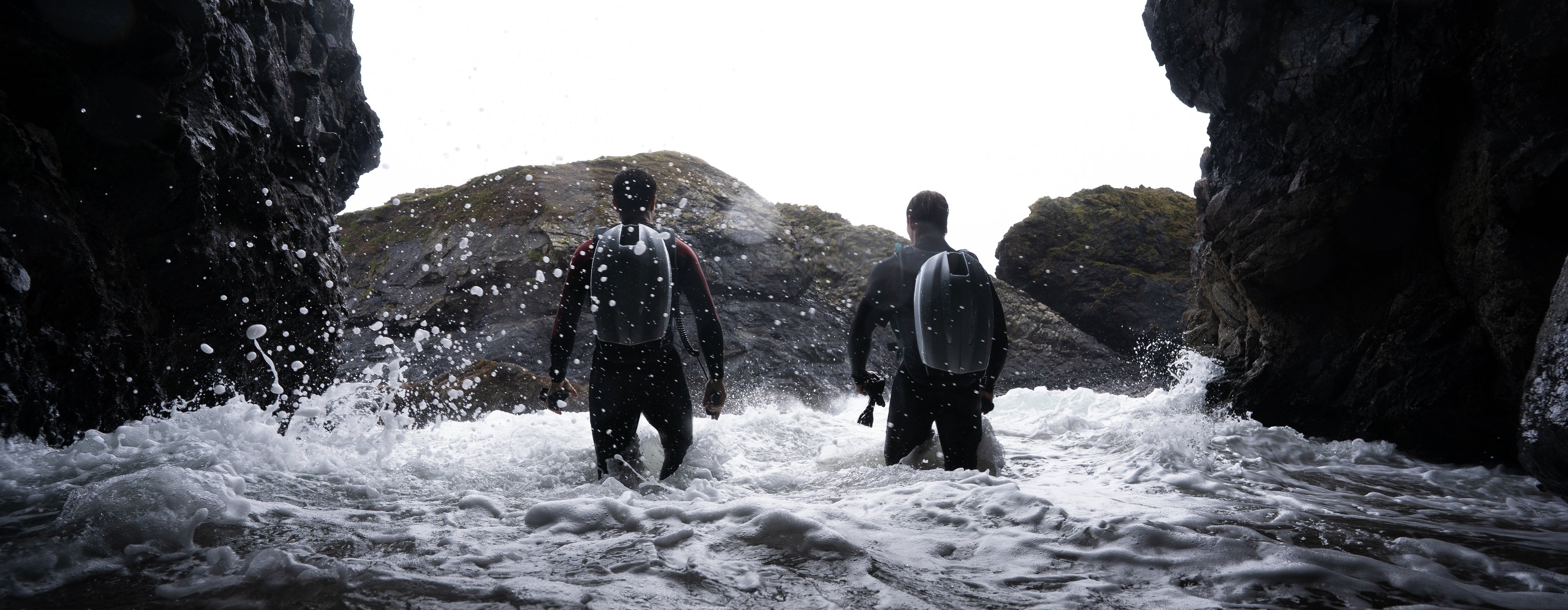 2x Underwater Jetpacks walking out of cave into a stormy sea