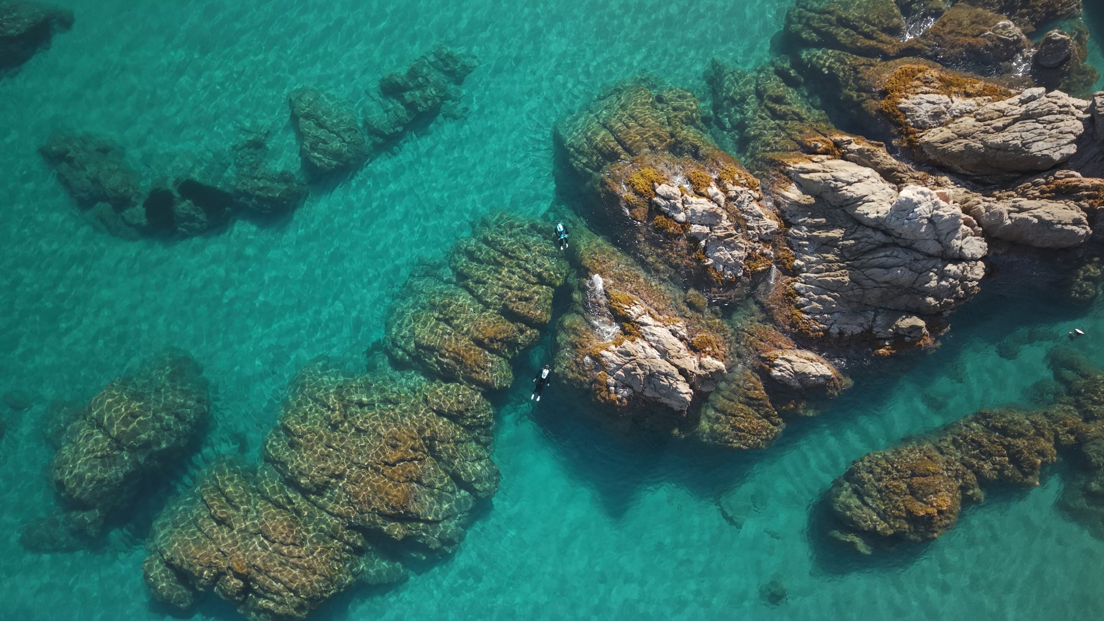 Superyacht toy CudaJet flying over remote coastline in the Mediterranean