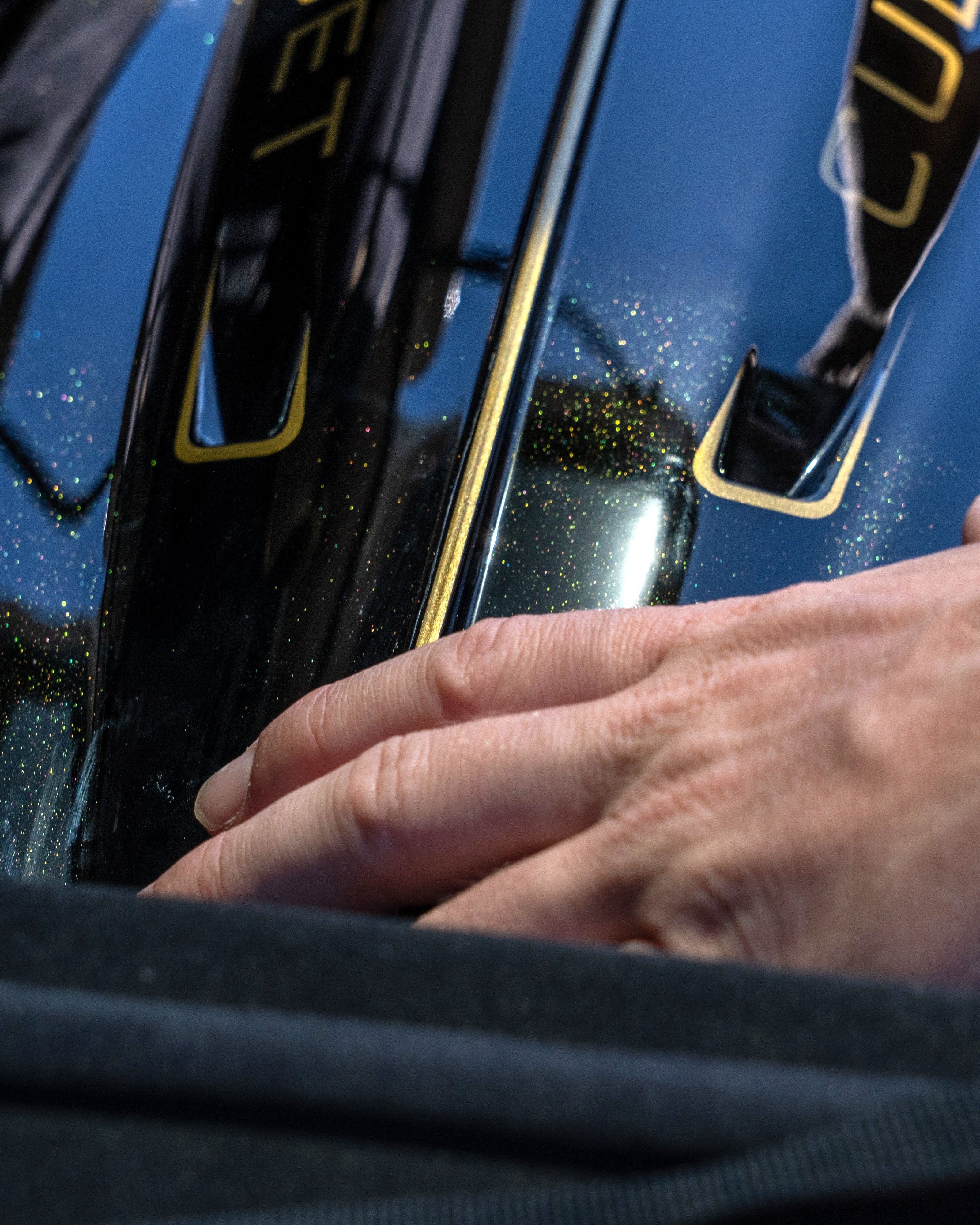 Close-up of a person's hand touching a Founder's Edition Jetpack