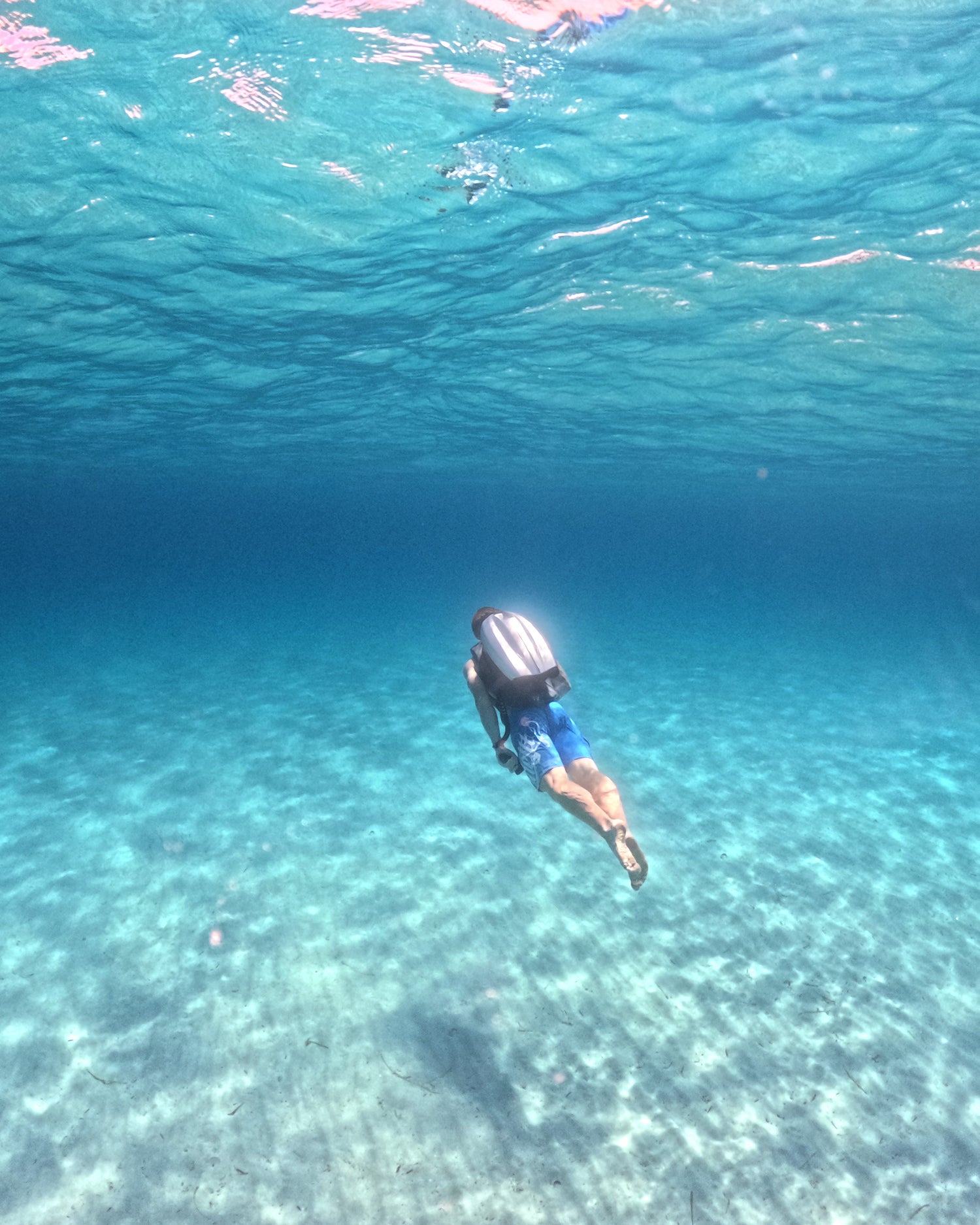 Superyacht toy CudaJet Underwater Jetpack flying in open blue water